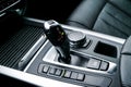 Automatic gear stick transmission of a modern car, multimedia and navigation control buttons. Car interior details. Transmission Royalty Free Stock Photo