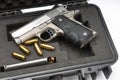 Automatic handgun and bullets in a plastic hard case on white background Royalty Free Stock Photo