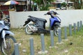 Automatic Honda Vario 125 motorbike parked haphazardly