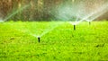 Automatic Lawn Sprinkler Watering Green Grass. Sprinkler With Automatic System. Garden Irrigation System Watering Lawn. Water