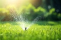 Automatic lawn sprinkler watering green grass. Sprinkler with automatic system. Garden irrigation system watering lawn. Water