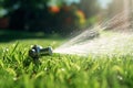 Automatic lawn sprinkler watering green grass. Sprinkler with automatic system. Garden irrigation system watering lawn. Water Royalty Free Stock Photo