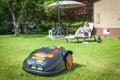 Automatic lawnmower garden scenery Royalty Free Stock Photo
