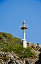 Automatic lighthouse on the rocks Royalty Free Stock Photo