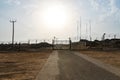 Automatic metal gate. Barbed wire fence block the way. gate to a closed area