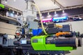 Automatic plastic injection molding machine during work at exhibition