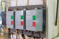 Automatic push-button switches of network equipment of three-phase network installed on the wall in the scientific and industrial Royalty Free Stock Photo