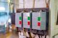 Automatic push-button switches of network equipment of three-phase network installed on the wall in the scientific and industrial Royalty Free Stock Photo