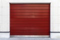 Automatic red roller shutter doors on the ground floor