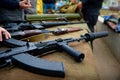Automatic rifle with a silencer on the table with weapons. Royalty Free Stock Photo