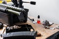 Automatic rifle on stand on the table of the weapons workshop. Royalty Free Stock Photo