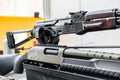Automatic rifle on stand on the table of the weapons workshop. Royalty Free Stock Photo