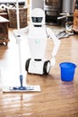 Automatic robot floor scrubber is doing his work