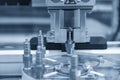 The automatic robotic arm gripping the spark plug part in production line. The hi-technology material handling system with robotic