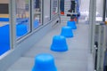 Automatic robotic production line with moving plastic blue pots on conveyor belt Royalty Free Stock Photo