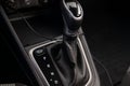 Automatic shift gear knob in the passenger compartment of the car in black for driving and acceleration. Abstract image of fast Royalty Free Stock Photo