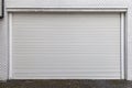 Automatic silver roller shutter doors on the ground floor Royalty Free Stock Photo