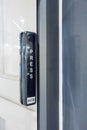 Automatic sliding door with wireless push button for user controller. Royalty Free Stock Photo