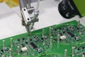 The automatic soldering robot operation with PCB board Royalty Free Stock Photo