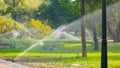 Automatic sprinkler system watering the lawn. Royalty Free Stock Photo
