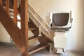 Automatic stairlift on staircase for elderly or disability in a house, Royalty Free Stock Photo