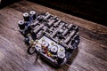 Automatic transmission valve body on wooden background Royalty Free Stock Photo