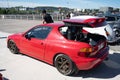 Automatic trunk opening of a red Honda CR-X Del Sol at an exhibit