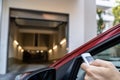 Automatic Wireless Home Garage Door. Hand Using Controller Royalty Free Stock Photo