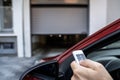 Automatic Wireless Home Garage Door. Hand Using Controller Royalty Free Stock Photo