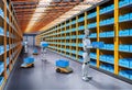 Automation warehouse with assistant robot work in warehouse