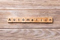 Automation word written on wood block. Automation text on wooden table for your desing, concept