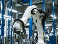 automative factory, a robotics arm with a milling spindle attachment performs the finishing cut on precision-engineered aluminum Royalty Free Stock Photo