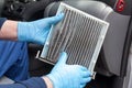 Replacing old and dirty car cabin air filter Royalty Free Stock Photo