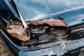 Automobile with broken headlight after car accident