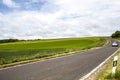 A car is driving on the national road in the countryside of Germany