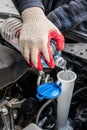 Automobile Maintenance. Filling the Windshield Washer Fluid on a Car Royalty Free Stock Photo