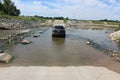 Automobile in the Middle of a River