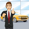 Automobile salesman holding the key Royalty Free Stock Photo