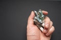 Automobile spark plugs in a man`s hand.