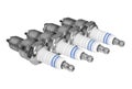 Automobile spark plugs on white surface