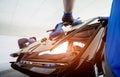 Automobile special workers replacing windscreen of a car in auto service