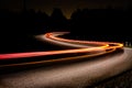 Automobile taillights on a dark country road Royalty Free Stock Photo