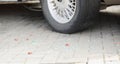 Automobile tyre and pieces of broken glass, car break in, traces of crime, car accident Royalty Free Stock Photo