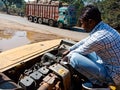 automobile workers repairing hydraulic engine at workshop in india dec 2019 Royalty Free Stock Photo