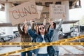 Automobiles behind. Group of feminist women have protest for their rights outdoors