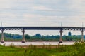 Automotive concrete and metal bridge over a river Royalty Free Stock Photo