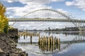 Automotive double-story arched Fremont Bridge over the Willamette River in Portland with water reflection and remnants of the Royalty Free Stock Photo