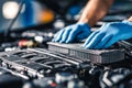 Automotive engine maintenance with technicians installing a new air filter Royalty Free Stock Photo