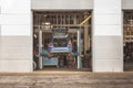 Automotive Maintenance: Car on Lifting Platform in Garage for Repairs and Inspection, Mechanic's Workshop Royalty Free Stock Photo