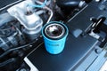 Automotive motor oil filter in the engine compartment Royalty Free Stock Photo